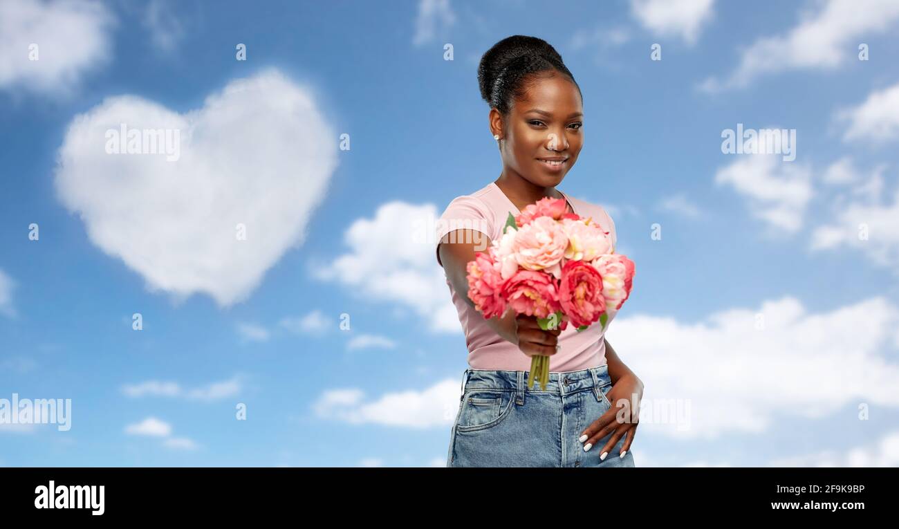 happy african american woman with bunch of flowers Stock Photo - Alamy