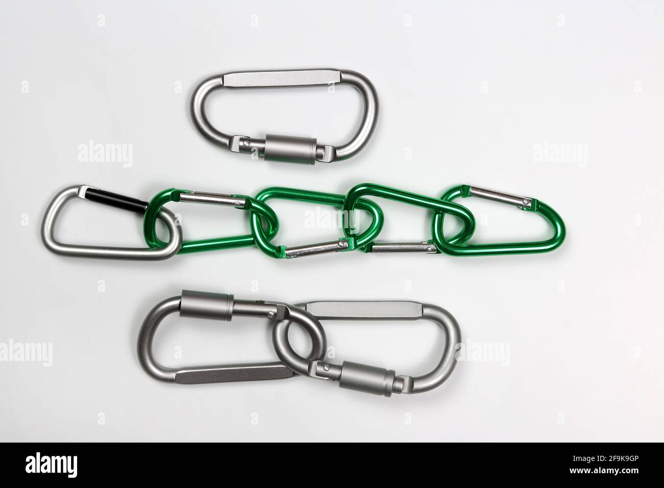 much bonded to each other aluminum carabiners Stock Photo