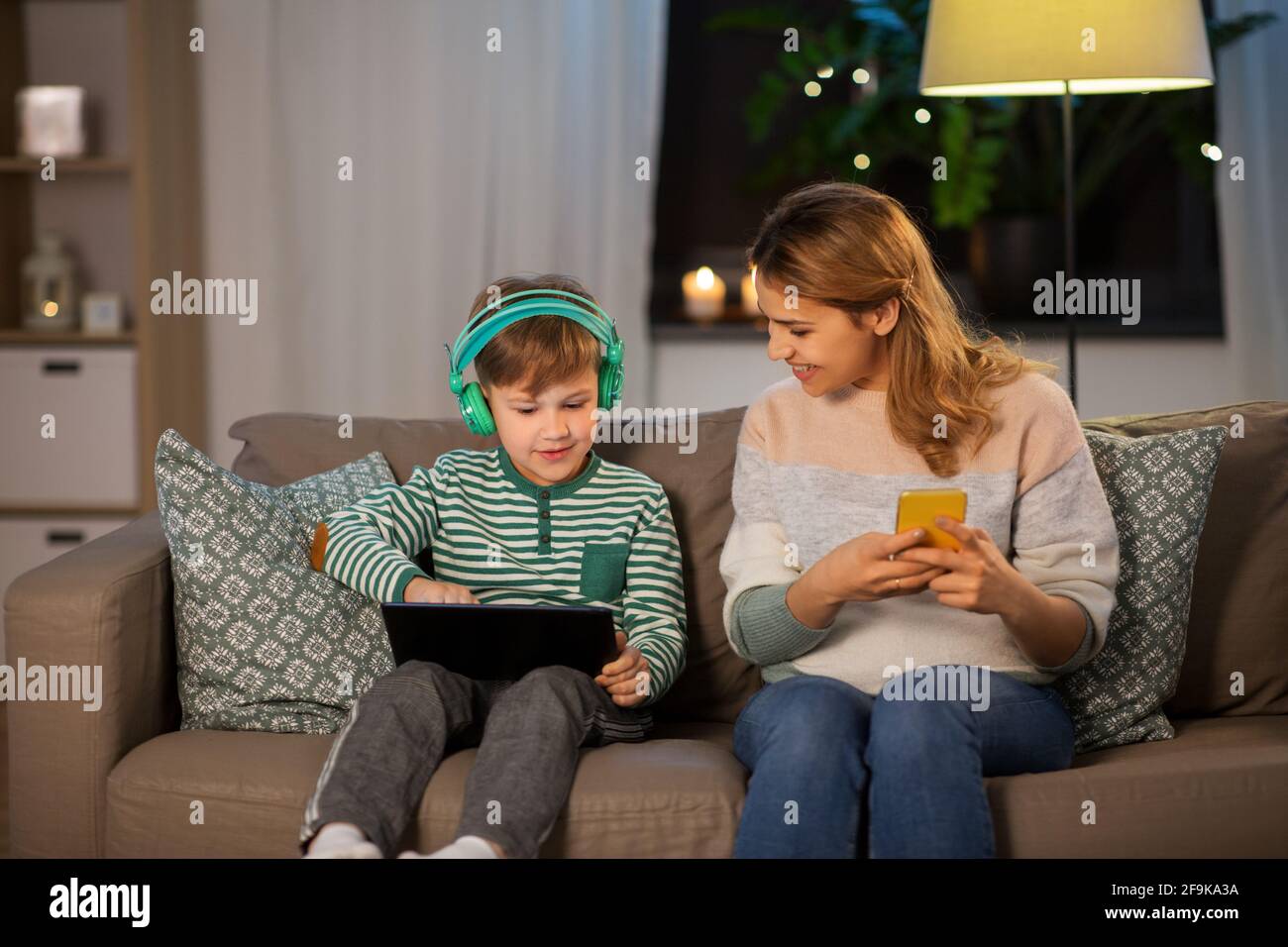 mother and son using gadgets at home Stock Photo - Alamy