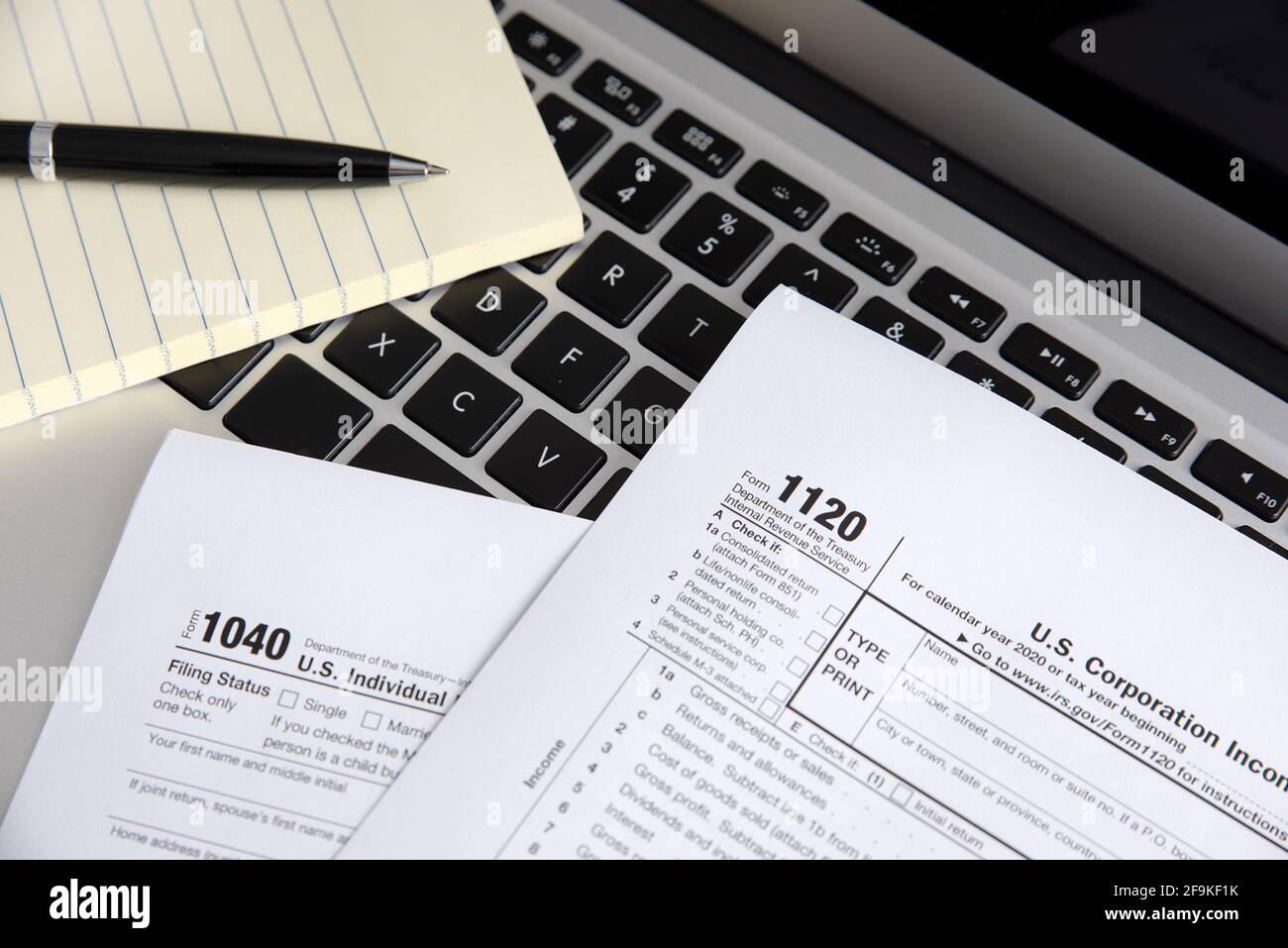 US Individual income tax return. US tax forms on laptop Stock Photo