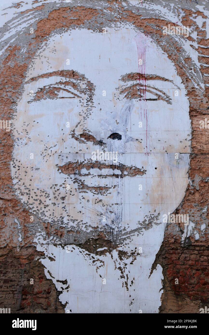 Portrait on the wall in Exeter, Devon engraved by street artist Alexandre Farto known as Vhils Stock Photo