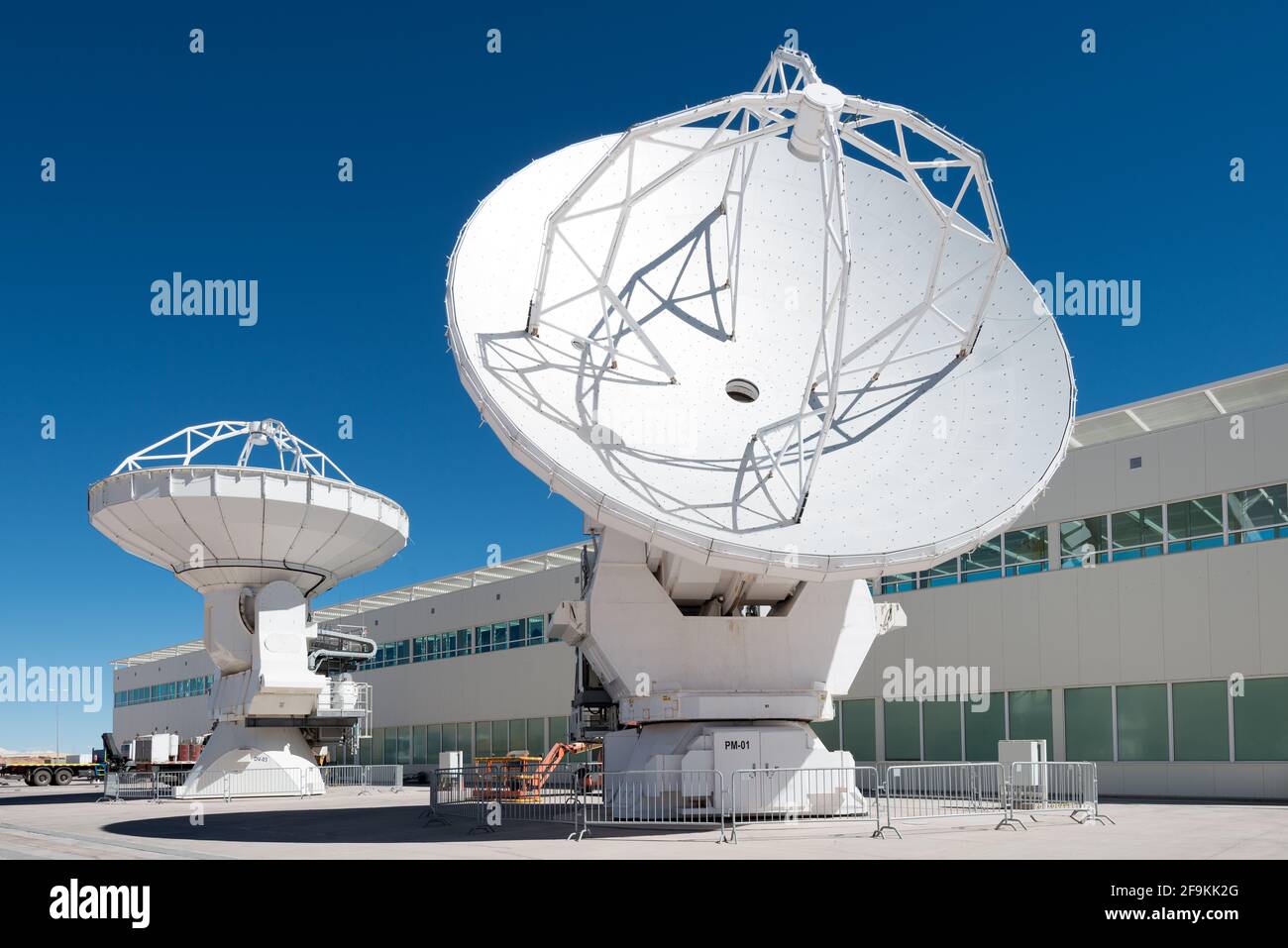 San Pedro de Atacama, Atacama Desert, ALMA Base Camp, Chile – ALMA Base Camp infrastructure and machinery with large radio telescopes. Stock Photo
