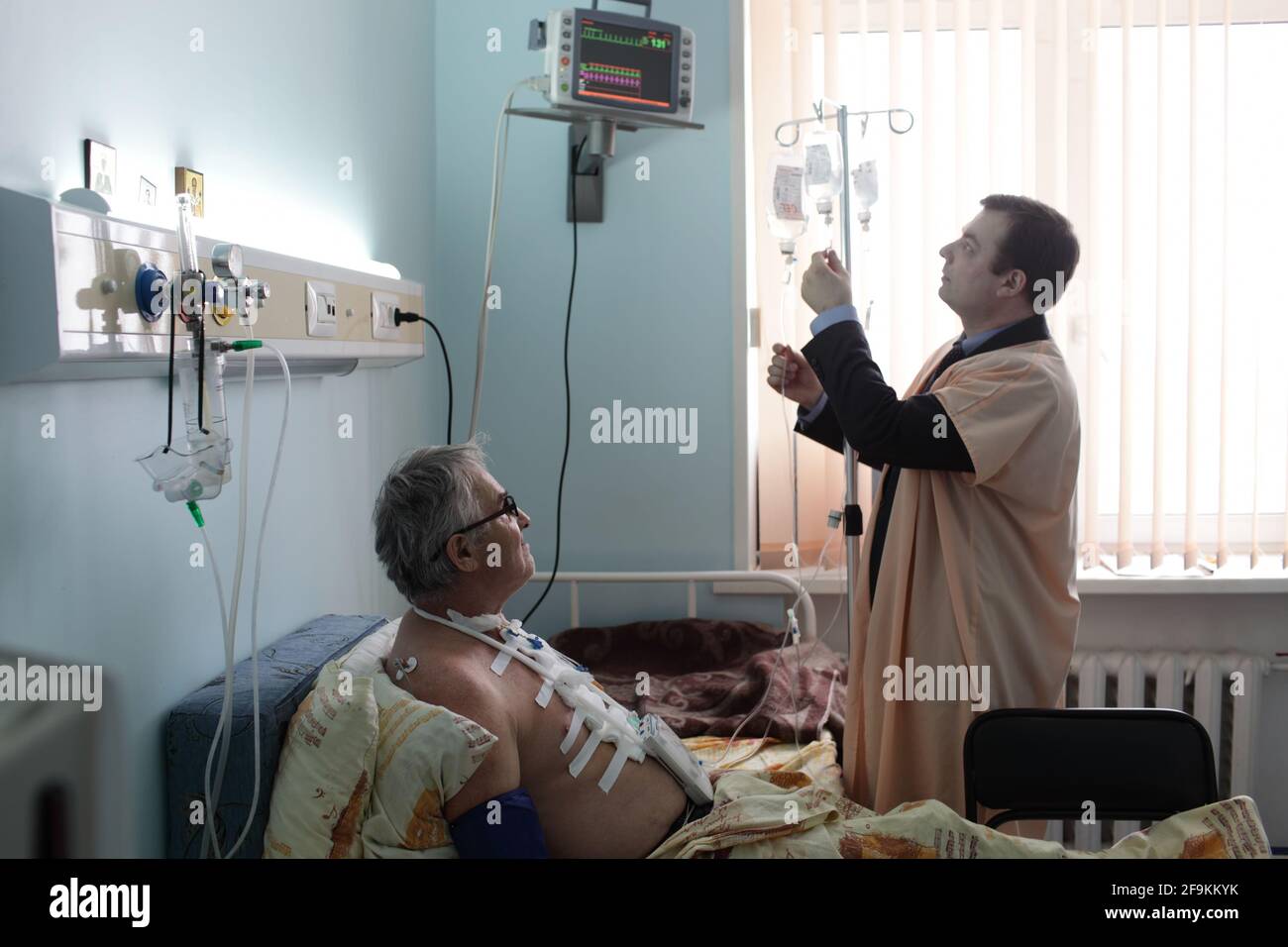 Nurse boy with patient in a hospital ward Stock Photo - Alamy