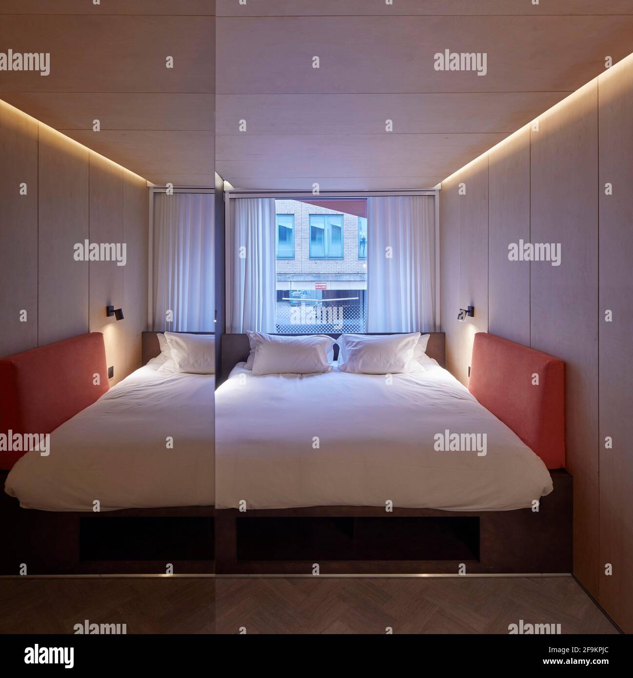 Bedroom interior. Stow-Away Waterloo Hotel, London, United Kingdom. Architect: Doone Silver Kerr, 2019. Stock Photo
