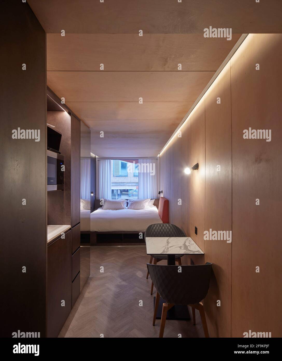 Bedroom interior. Stow-Away Waterloo Hotel, London, United Kingdom. Architect: Doone Silver Kerr, 2019. Stock Photo