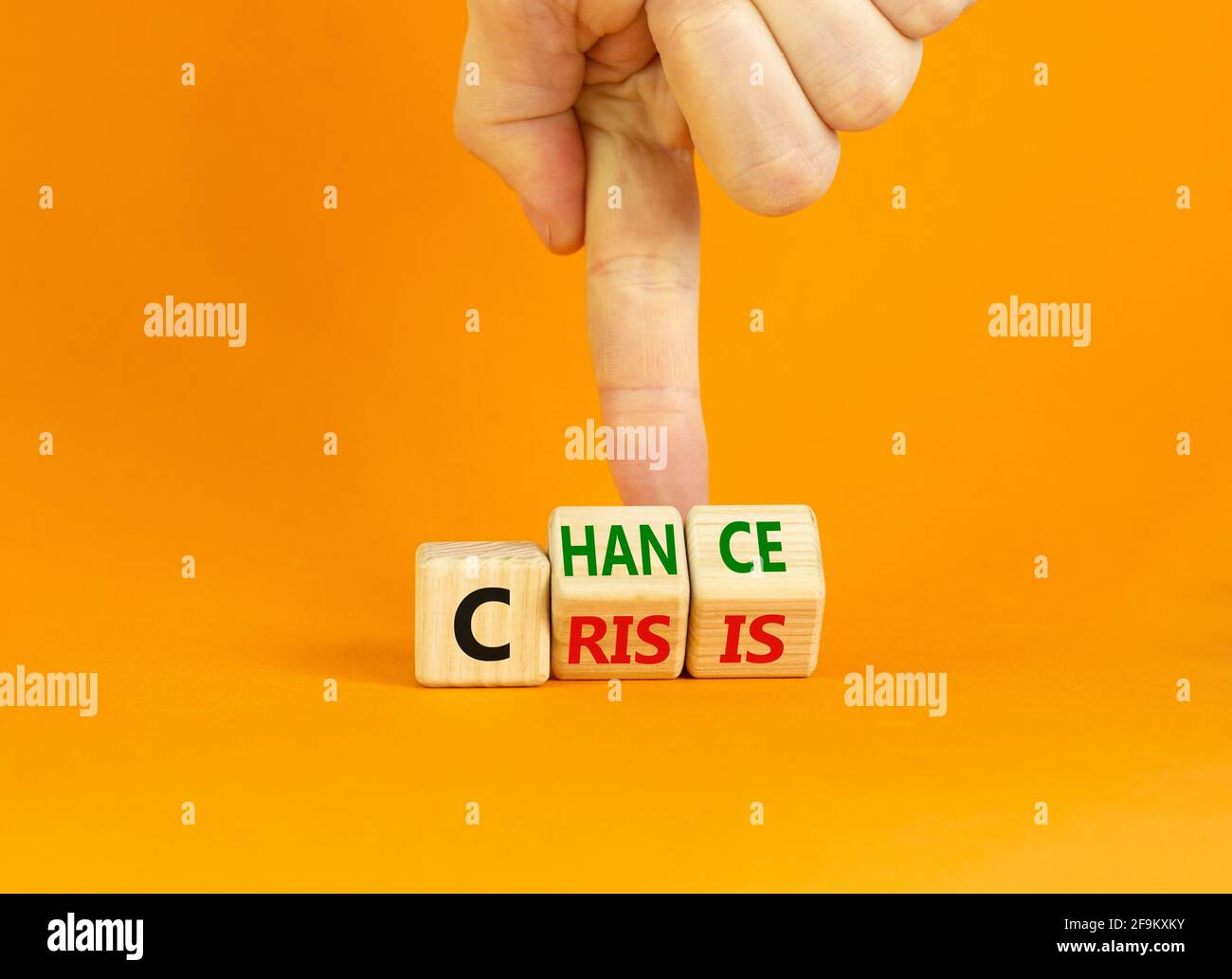 Crisis or chance symbol. Businessman turns cubes and changes the word ...