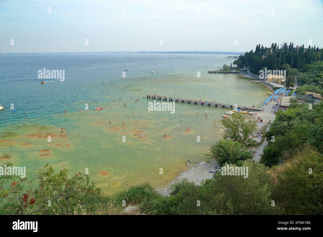 Sirmione beach, Lido delle Bionde, Il Pontile di Sirmione. Lake Garda, Lago di Garda, Gardasee, Italy Stock Photo