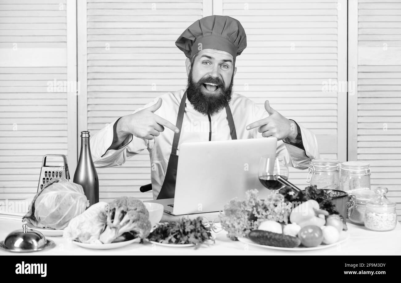 Happy bearded man. chef recipe. Cuisine culinary. Vitamin. Dieting organic food. Vegetarian salad with fresh vegetables. Healthy food cooking. Mature Stock Photo