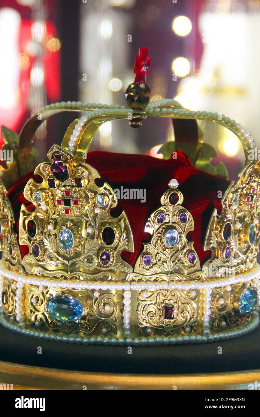 Golden crown with precious stones Stock Photo - Alamy