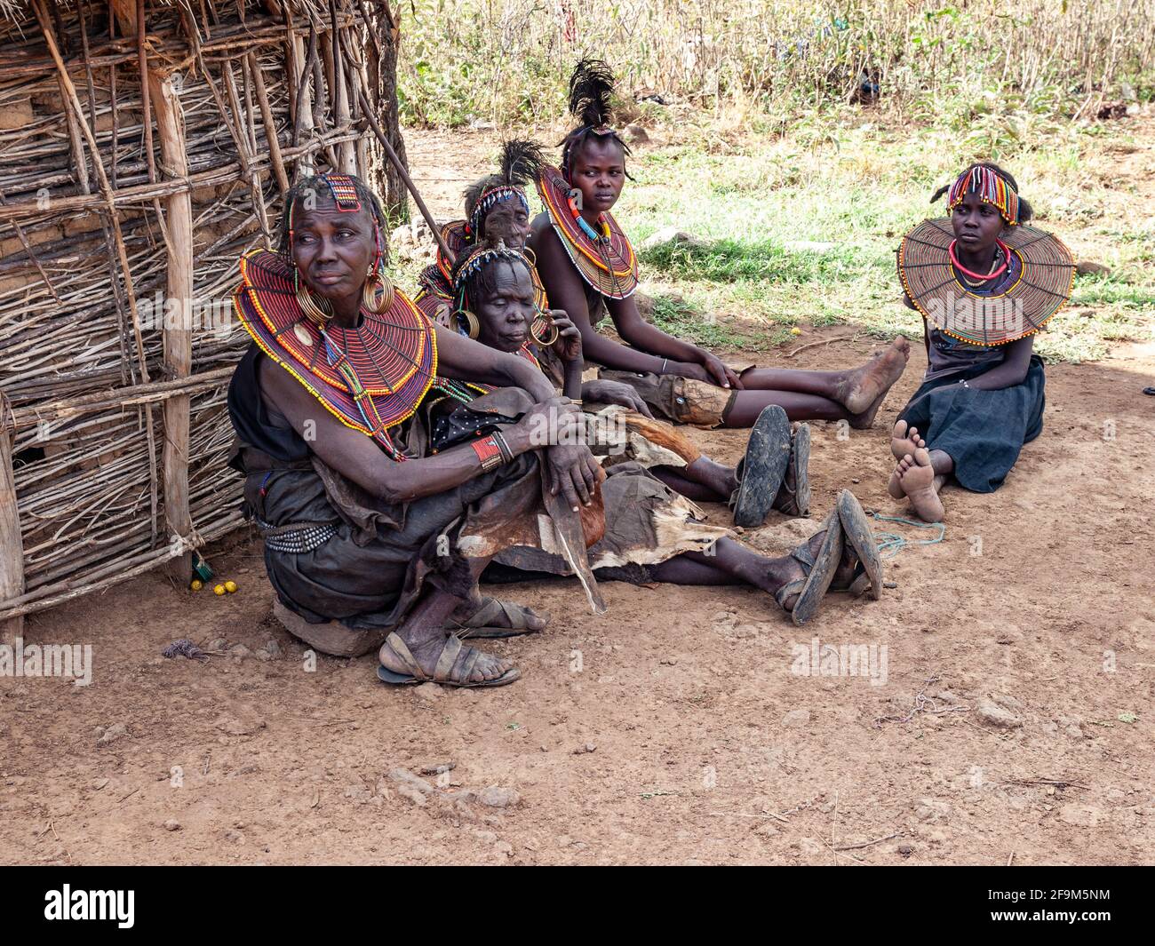 Native women in traditional garb,  posing in village. The Pokot people (also spelled Pökoot) live in West Pokot County and Baringo County in Kenya Stock Photo