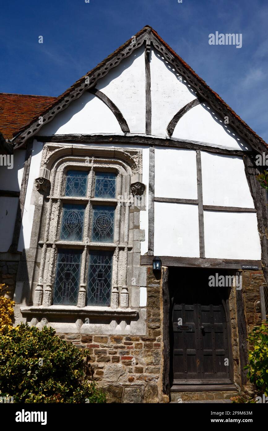 Quaint historic timber framed house with carved stone window frame at lower end of All Saints Street, Old Town, Hastings, East Sussex, England Stock Photo