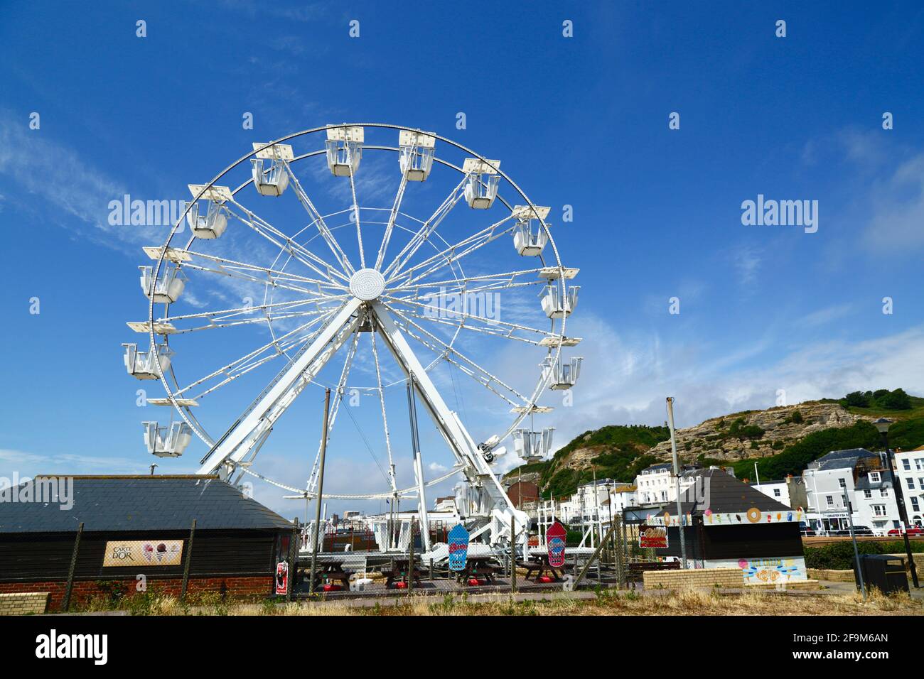 Hastings Ferris Wheel, West Hill in background, Hastings, East Sussex, England, UK Stock Photo