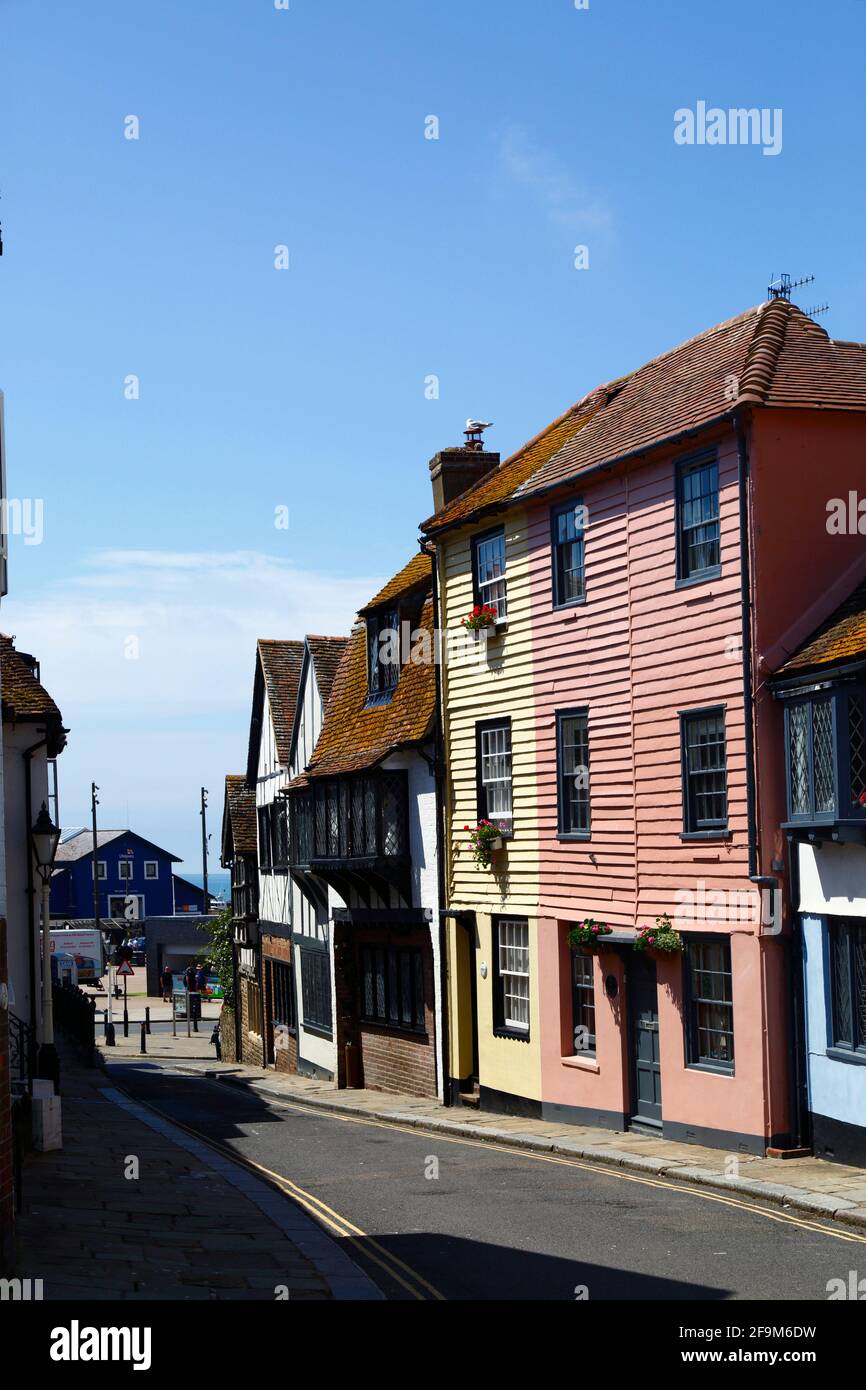 Quaint historic timber houses in All Saints Street in Old Town, looking towards the coast (sea just visible in distance), Hastings, East Sussex, UK Stock Photo