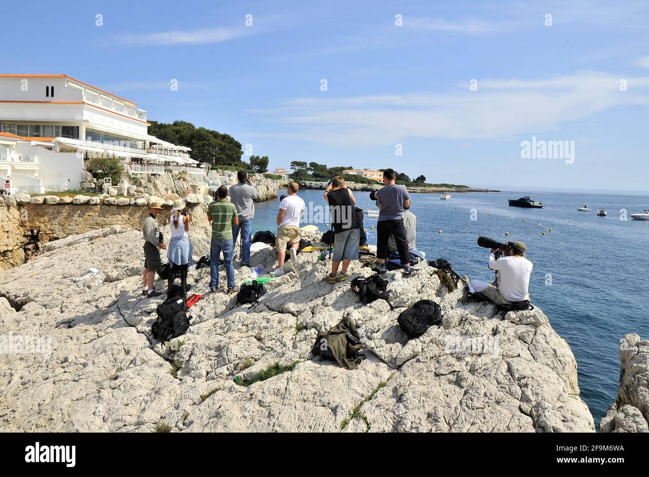 18th May 2011. Paparazzi, Photographers on the rocks by the hotel du Cap Eden Roc, Antibes, France Stock Photo
