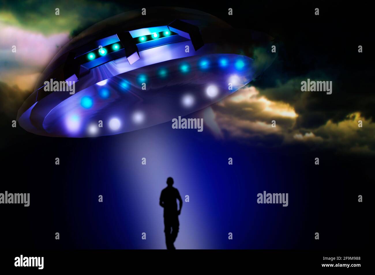 UFO abducts human Stock Photo