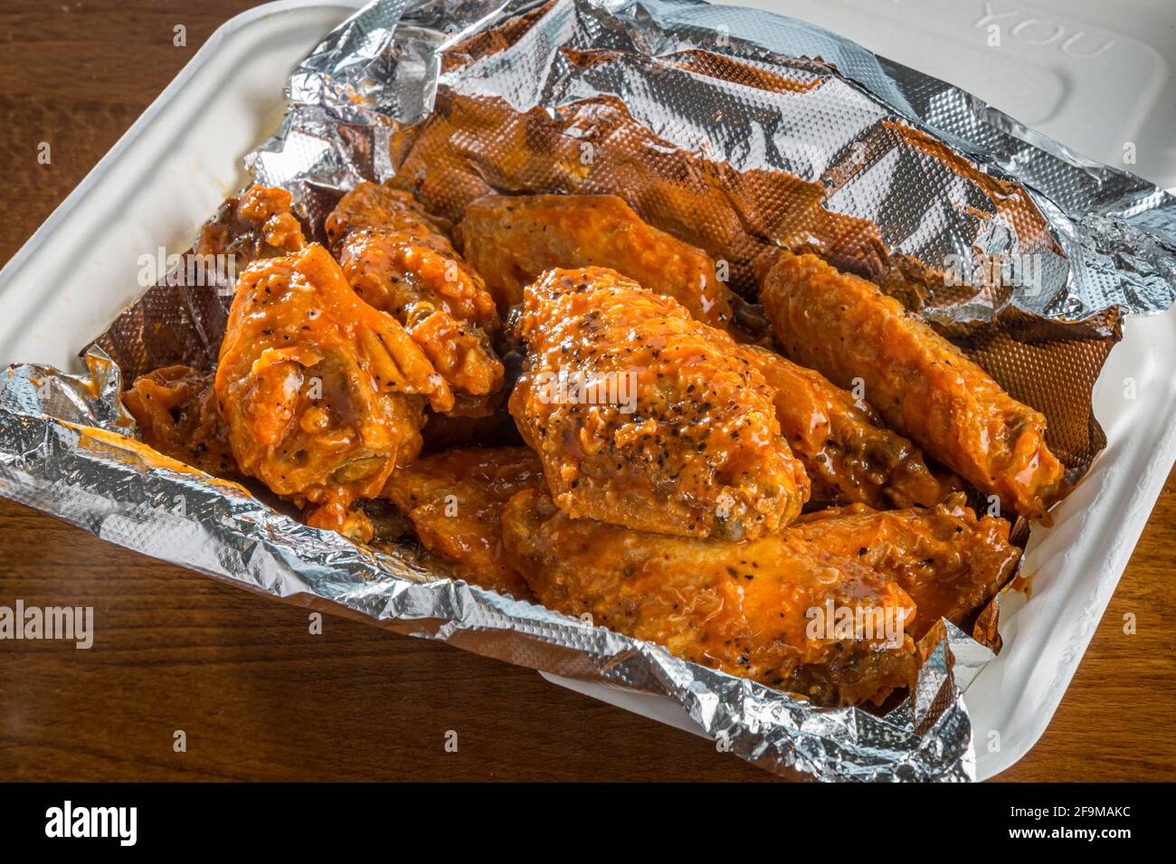 Spicy chicken wings take out Stock Photo