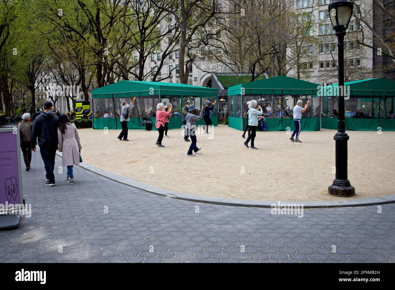 New York, NY, USA - Apr 19, 2021: Outdoor classroom doing exercises in Madison Square Park Stock Photo