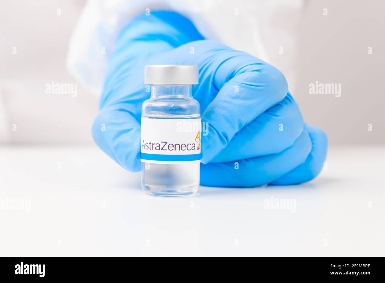 Astra Zeneca vial or bottle with pharmaceuticals demonstrated by health worker or scientist in rubber gloves, April 2021, San Francisco, USA  Stock Photo