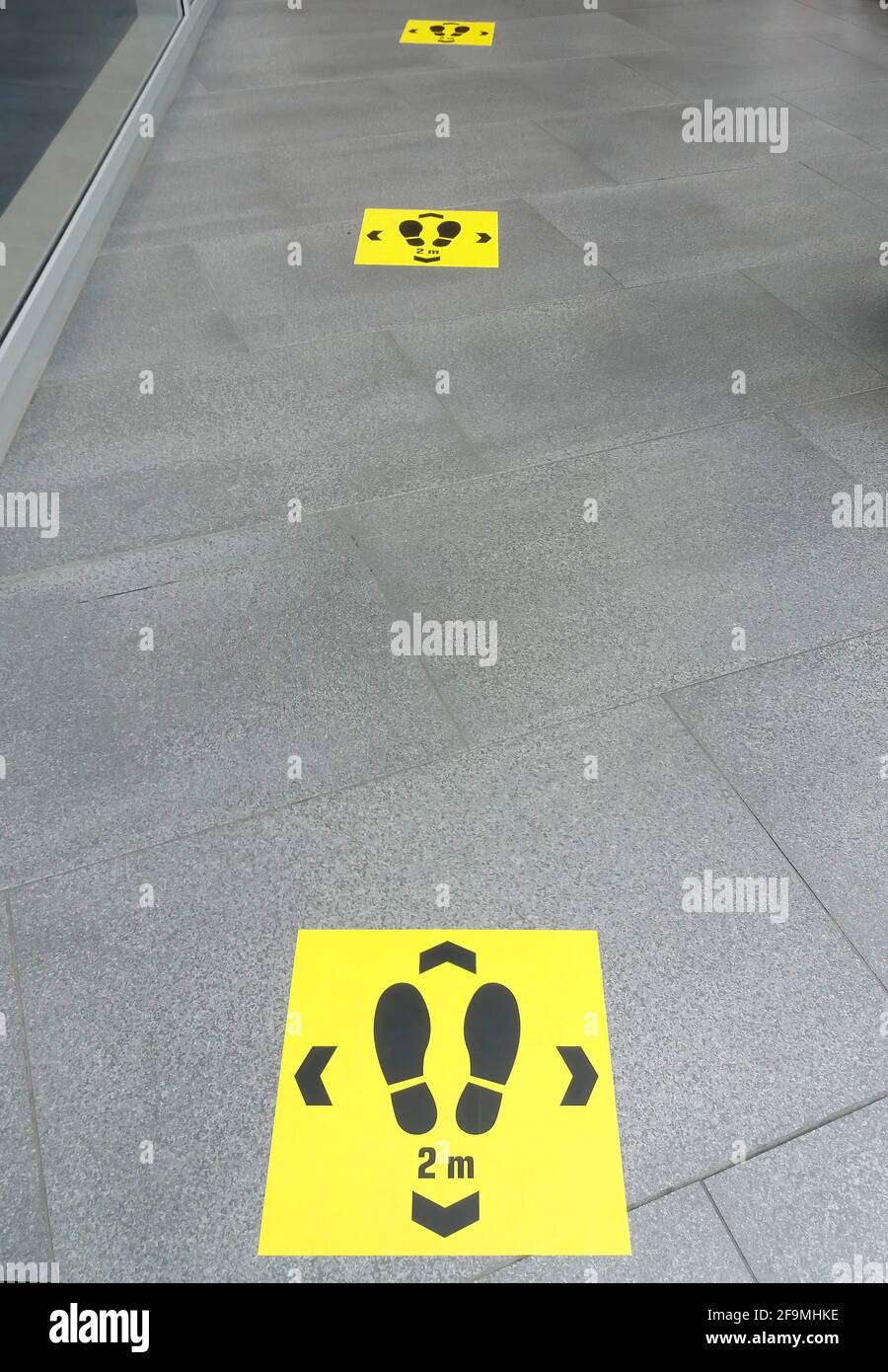 Keep distance sign printed on the floor, safety sticker on ground ...