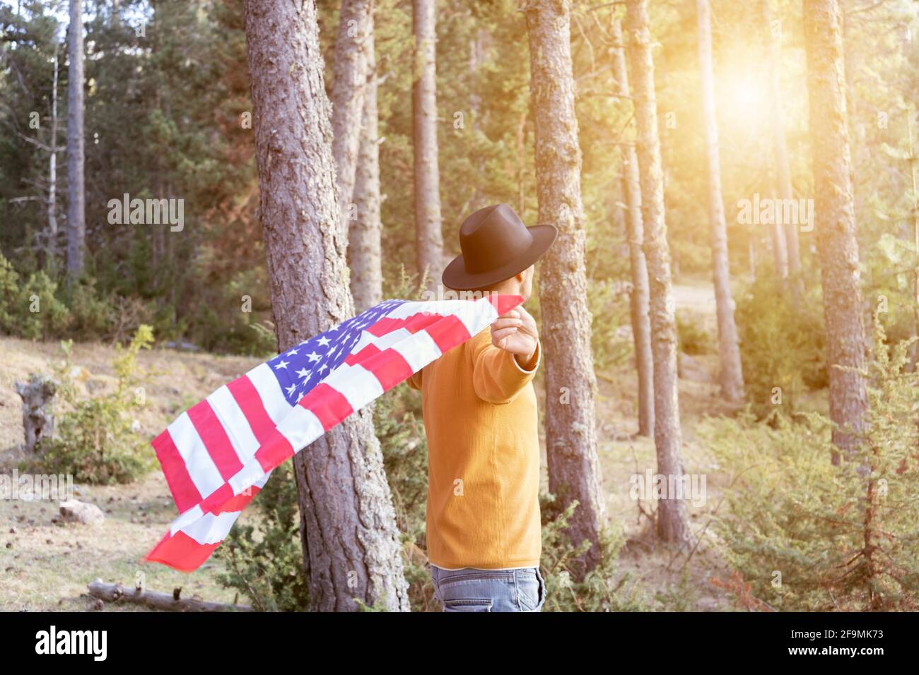 Cowboy waving hat hi-res stock 