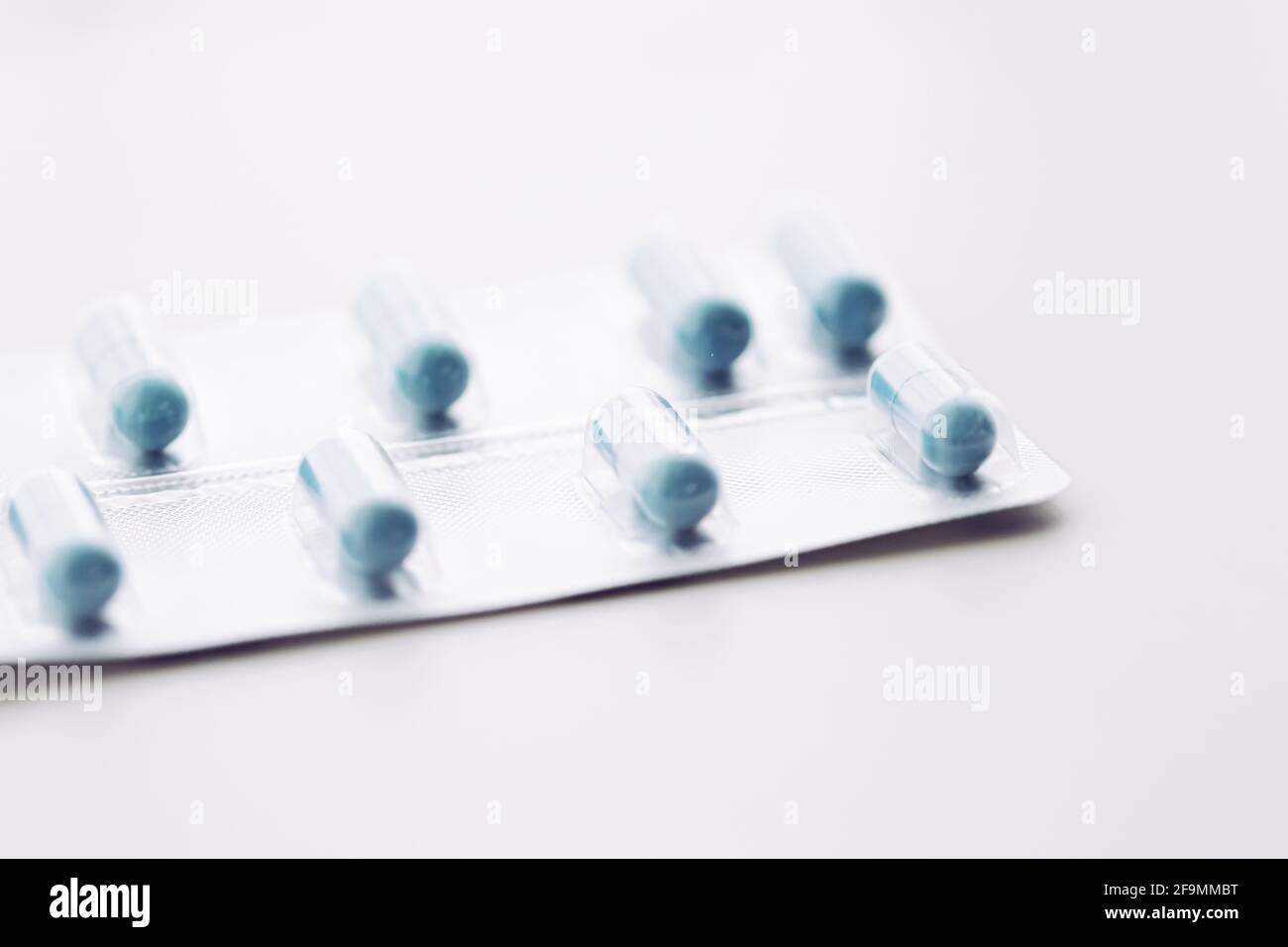 Blue pills and capsules as nutrition supplement, wellness and health care Stock Photo