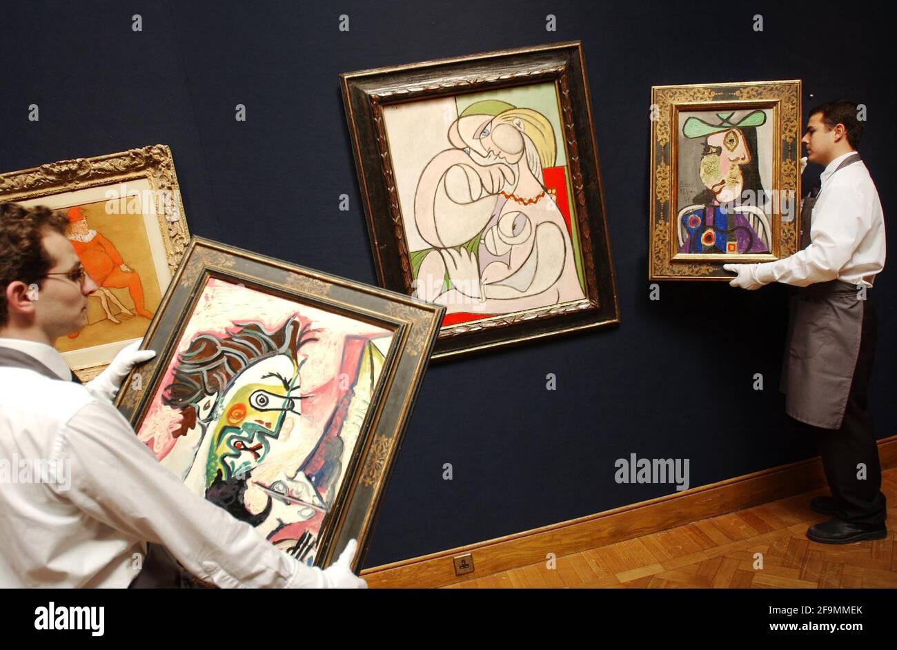 Four of nine Picasso's being hung at Christies this morning as part of their 'Impressionist and Modern art' sale taking place on 25th June. Leading the sale, Picasso's work is expected to fetch ¿15-20 Million.21 June 2002 photo Andy Paradise Stock Photo