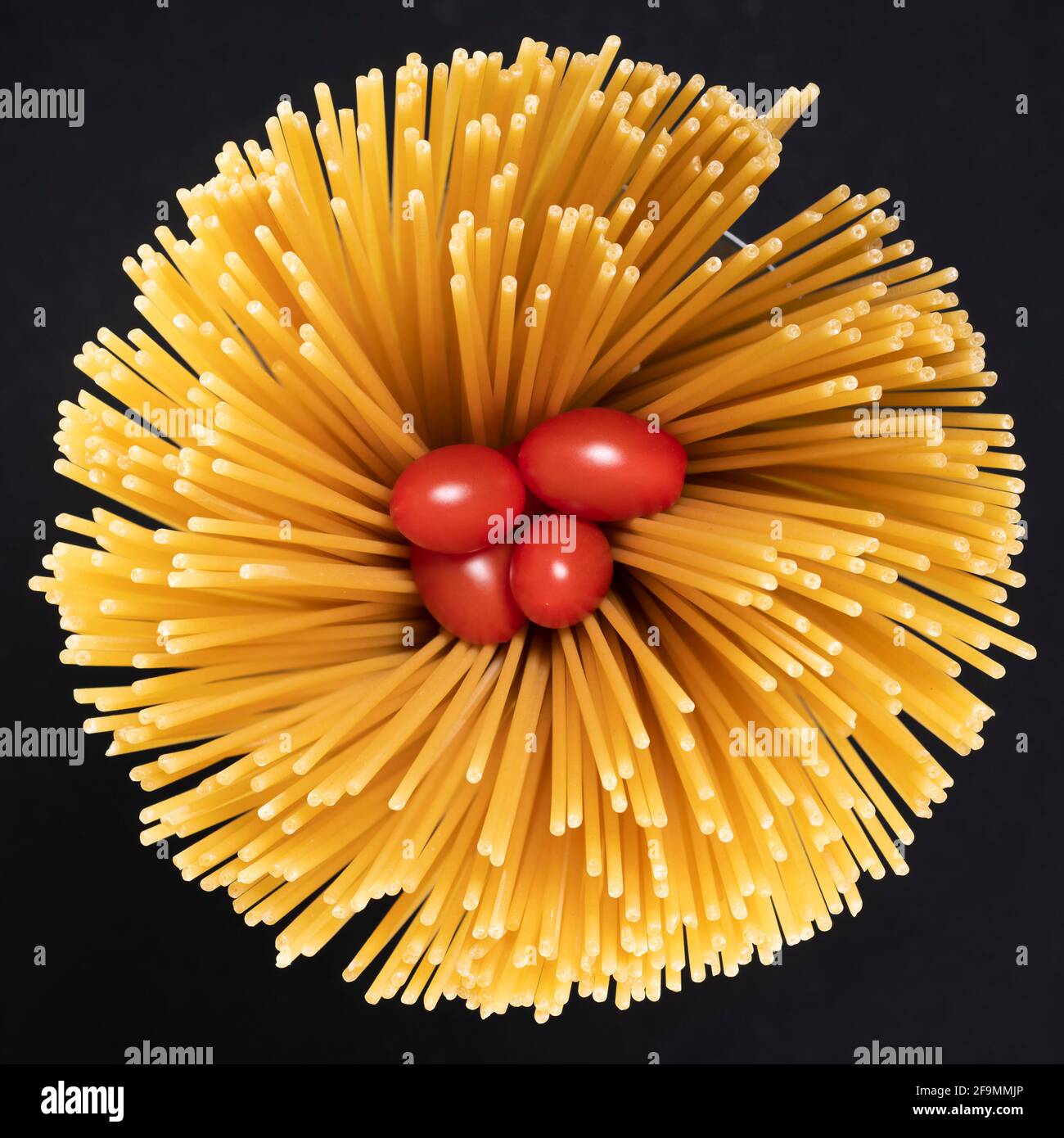 Abstract image of spaghetti and tomato, view from above Stock Photo