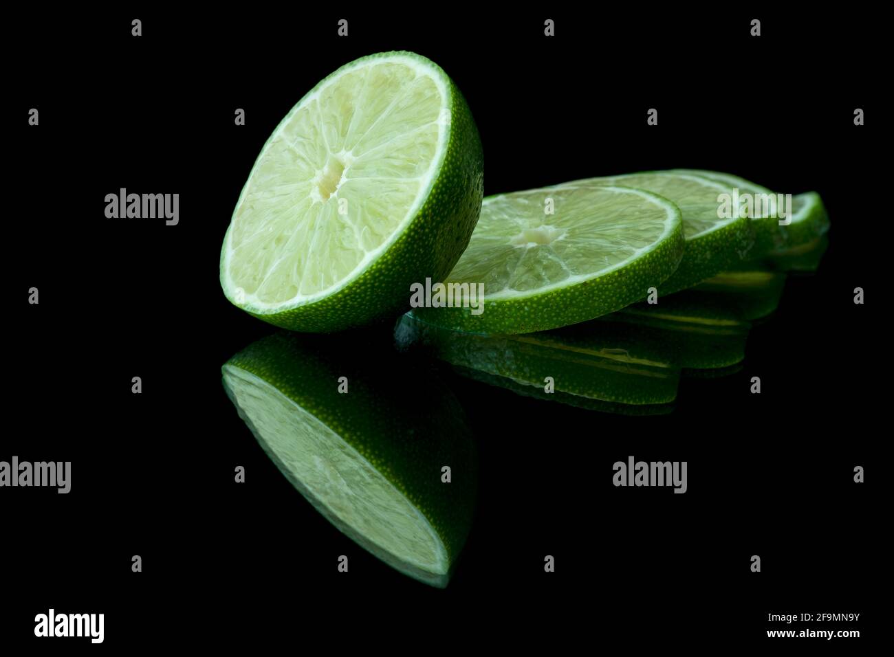Image of lime with reflection on dark background Stock Photo