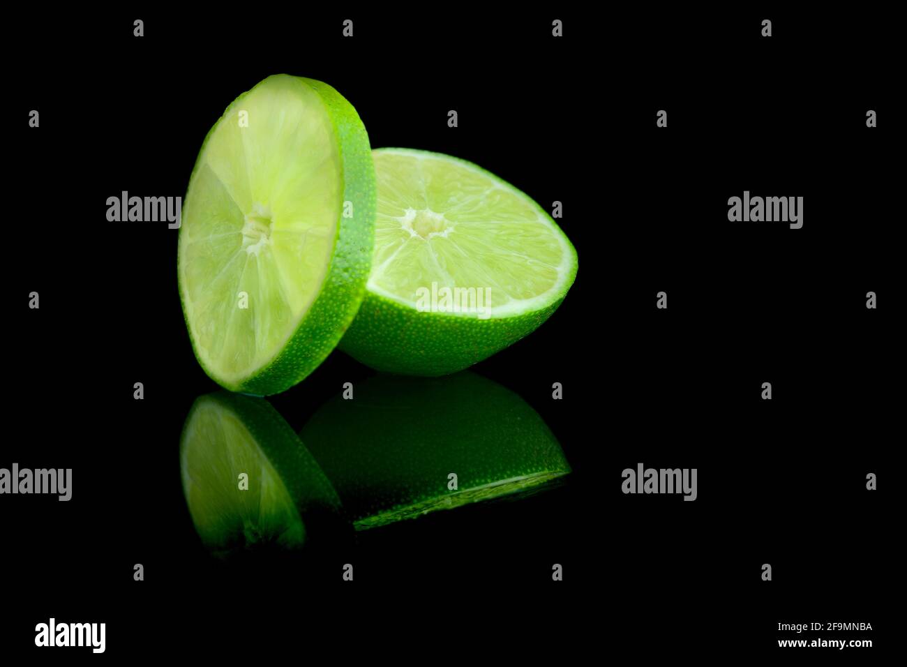Image of lime with reflection on dark background Stock Photo