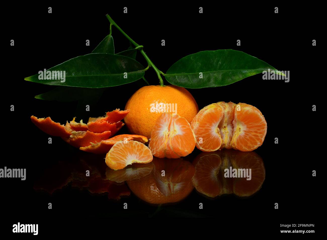 Orange, mandarin, tangerine citrus fruit on dark background Stock Photo