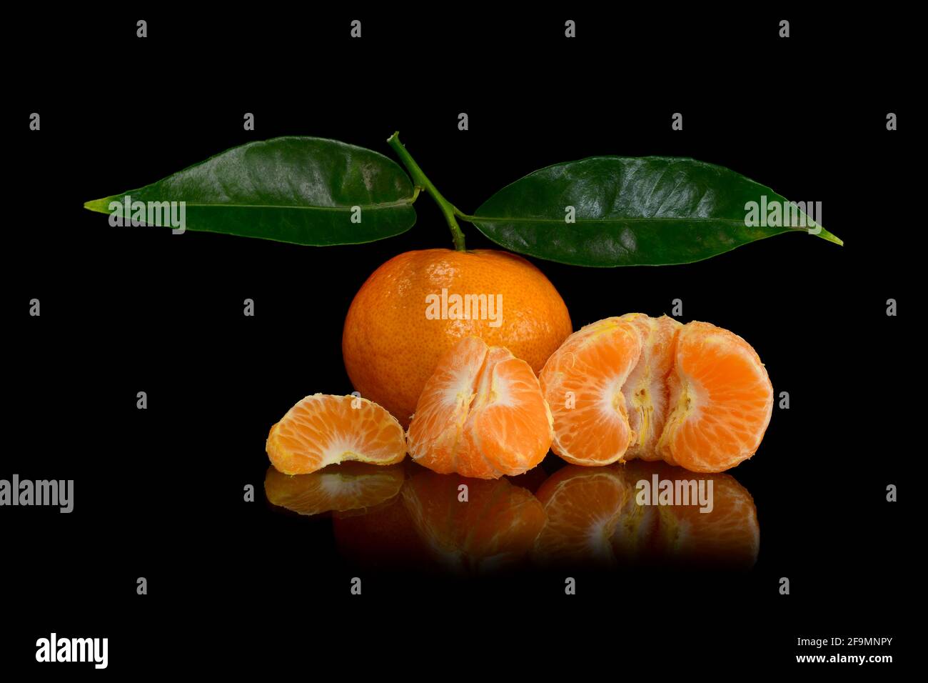 Orange, mandarin, tangerine citrus fruit on dark background Stock Photo