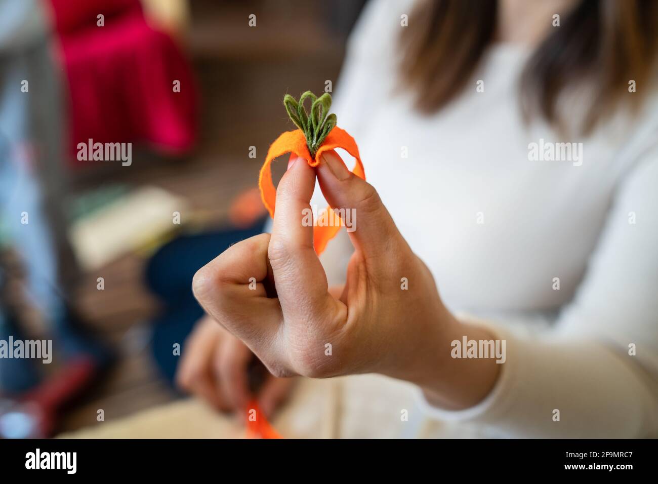 Close up on hands of unknown caucasian woman making decorative products at home leisure activity hobby arts and crafts Stock Photo