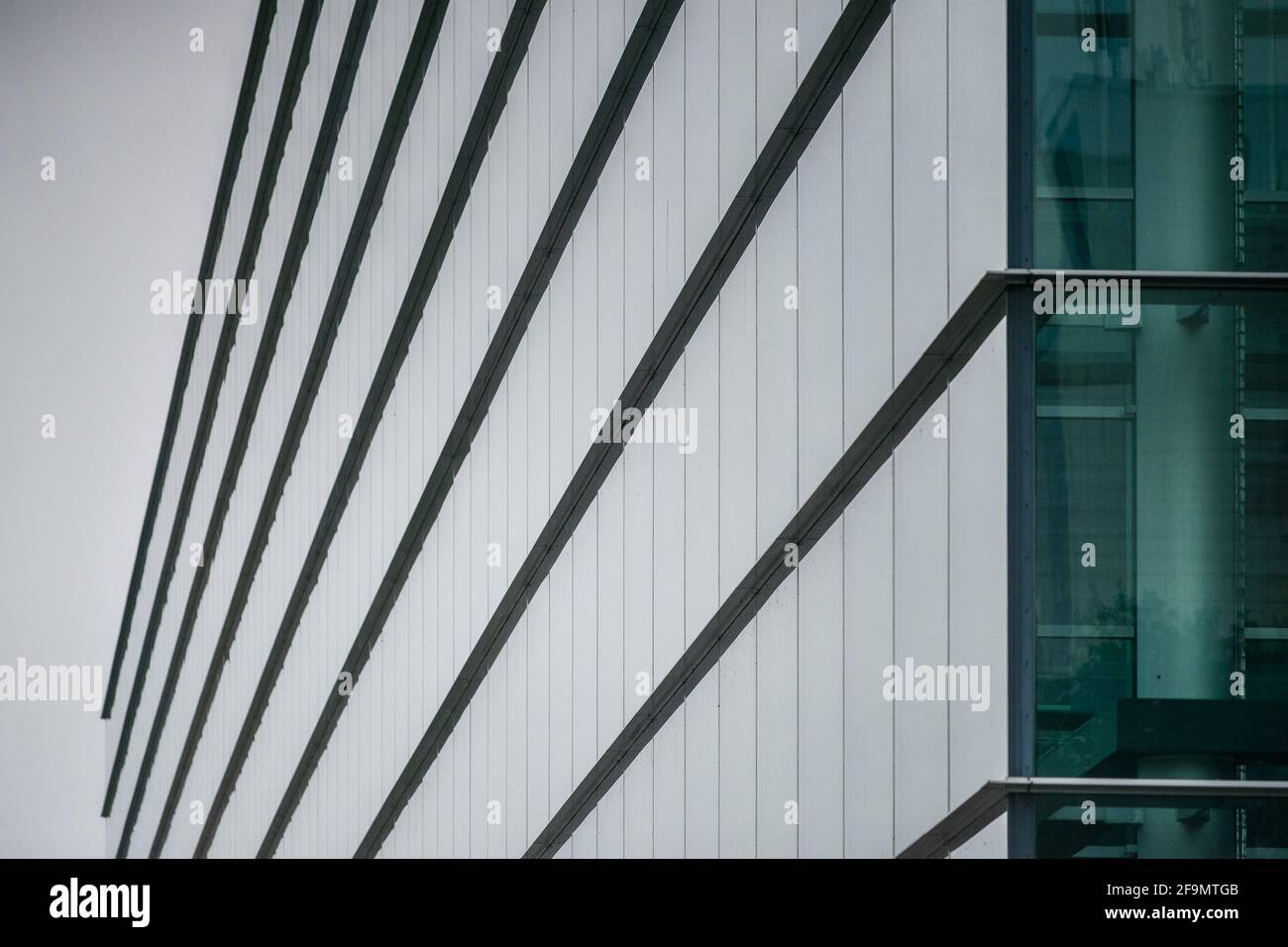 GERMANY DRESDEN - AUGUST 2015: New glass building of Volkswagen plant, greenery near a building. Glaeserne Manufaktur. Glass manufactory Volkswagen. Stock Photo