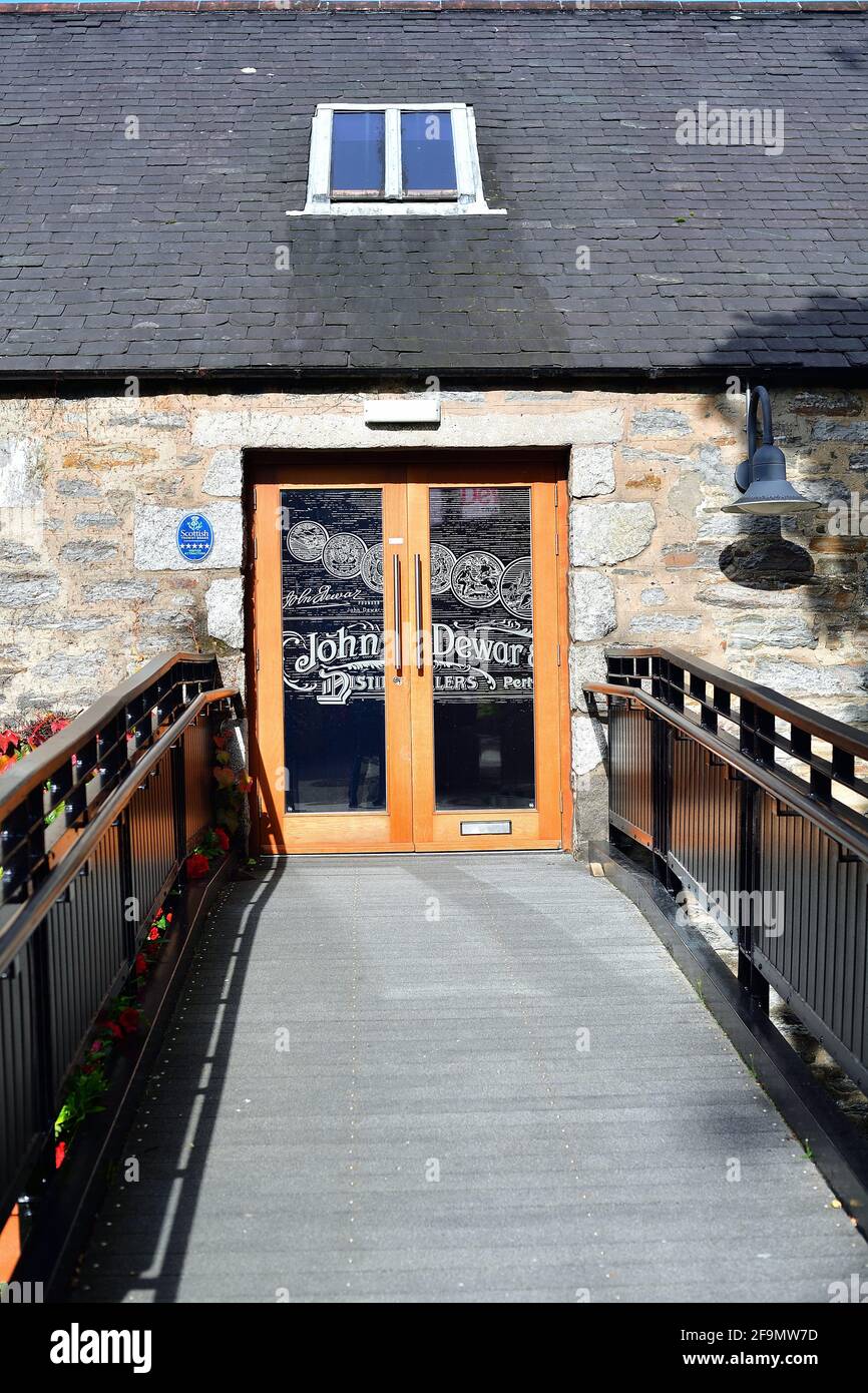 Aberfeldy, Scotland, United Kingdom. A door to a visitor center at the Dewar's Distiller.  Dewar's was founded in 1846. Stock Photo