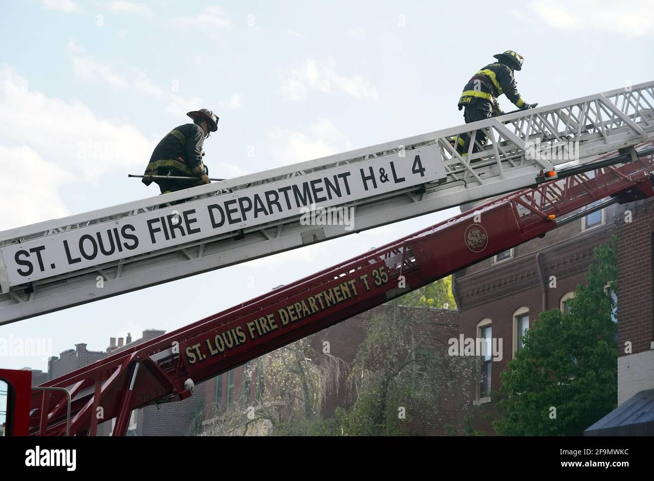 St. Louis, United States. 19th Apr, 2021. St. Louis firefighters climb