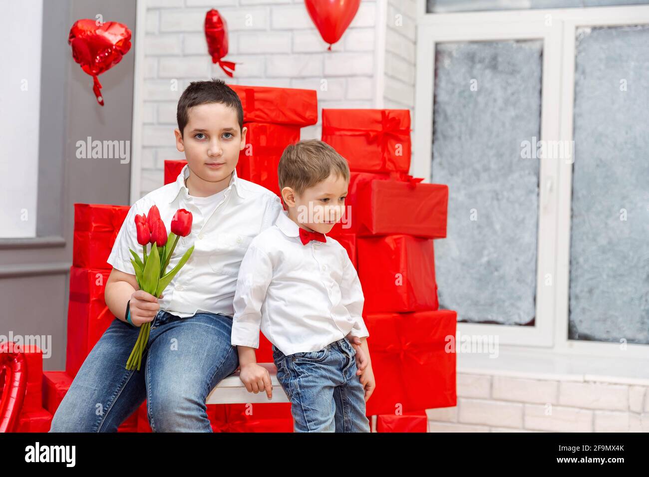 Congratulate mother with mothers day or birthday. Two beautiful kids Stock Photo
