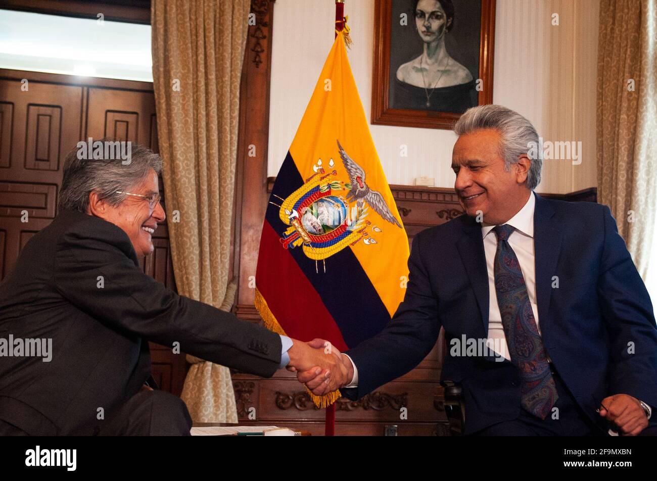 Lenin Moreno shakes hands with the elected president of Ecuador Guillermo Lasso during a meeting. The president-elect Guillermo Lasso and the outgoing president of Ecuador Lenin Moreno held a meeting in the framework of the transition of power in this activity were present Rocio de Moreno first lady and Lourdes Alcivar wife of Lasso, also were the vice president María Alejandra Muñoz the vice president starter Alfredo Borrero and his wife Lucia Pazmiño. Stock Photo