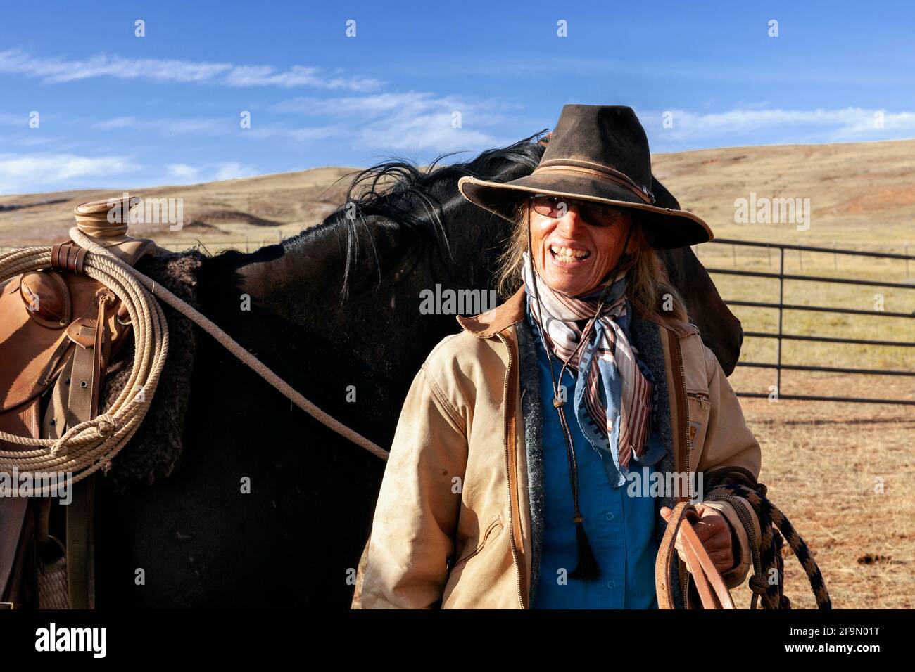 WY04130-00...WYOMING - Ranch hand cowgirl on the Willow Creek Ranch. Stock Photo