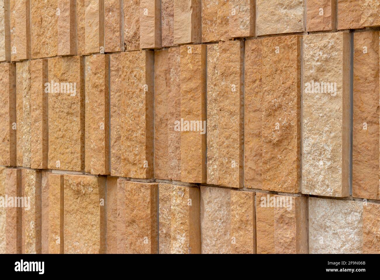 Modern rough textured limestone wall background with attractive