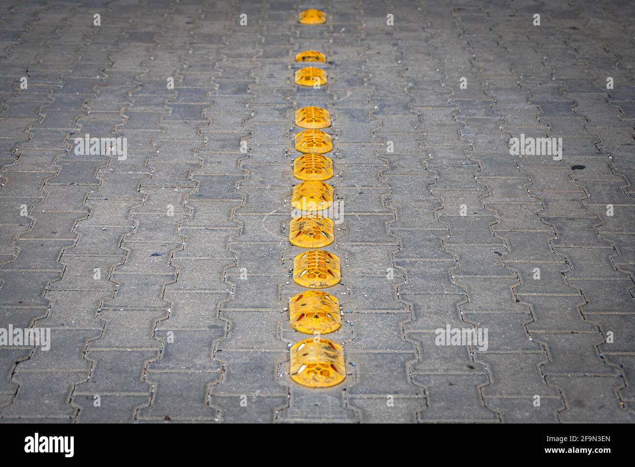 Road bumps for reduce speed. Small rubber bumps on the sidewalk road