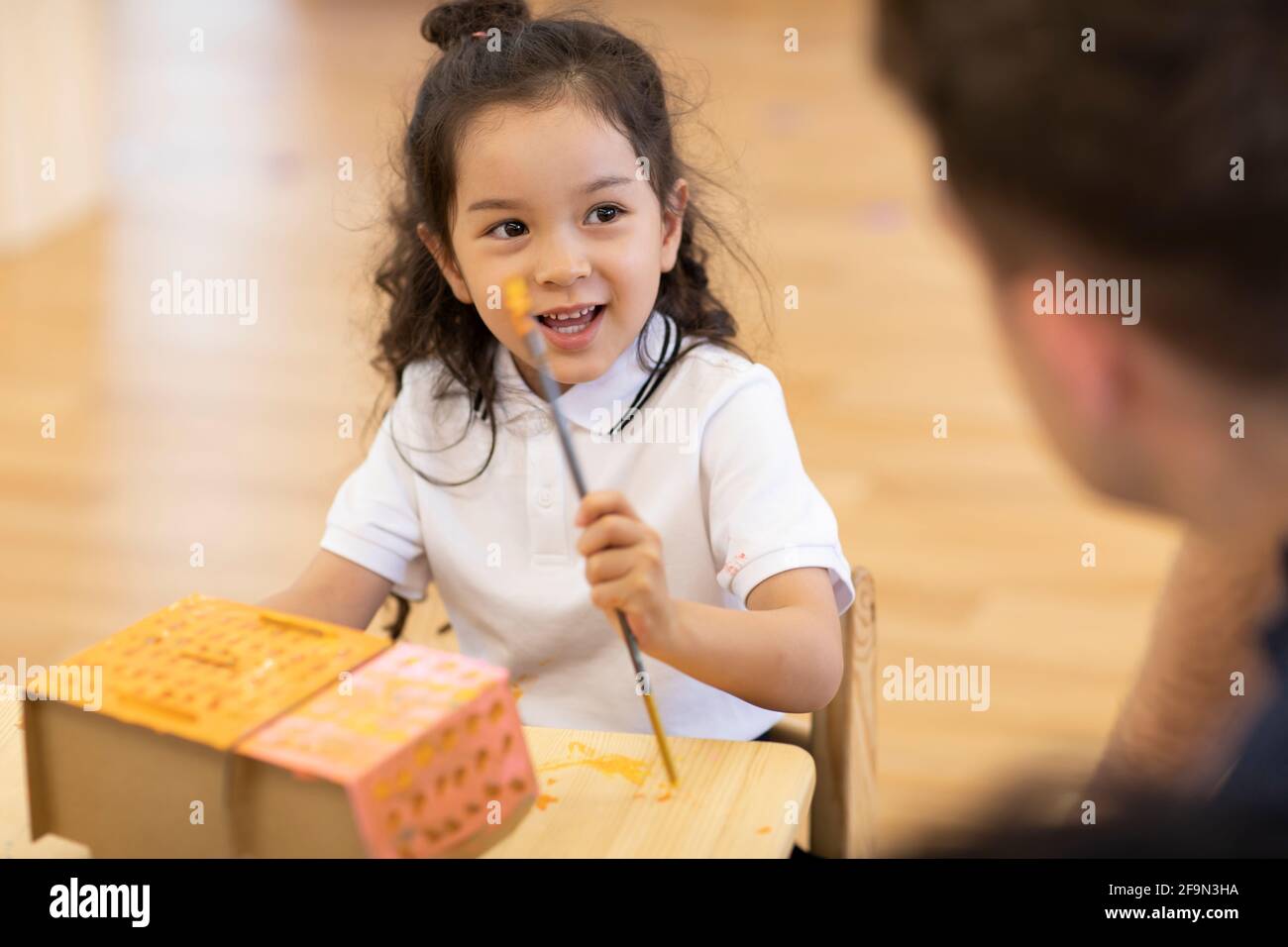 Foreign teacher teaching art class in classroom Stock Photo - Alamy