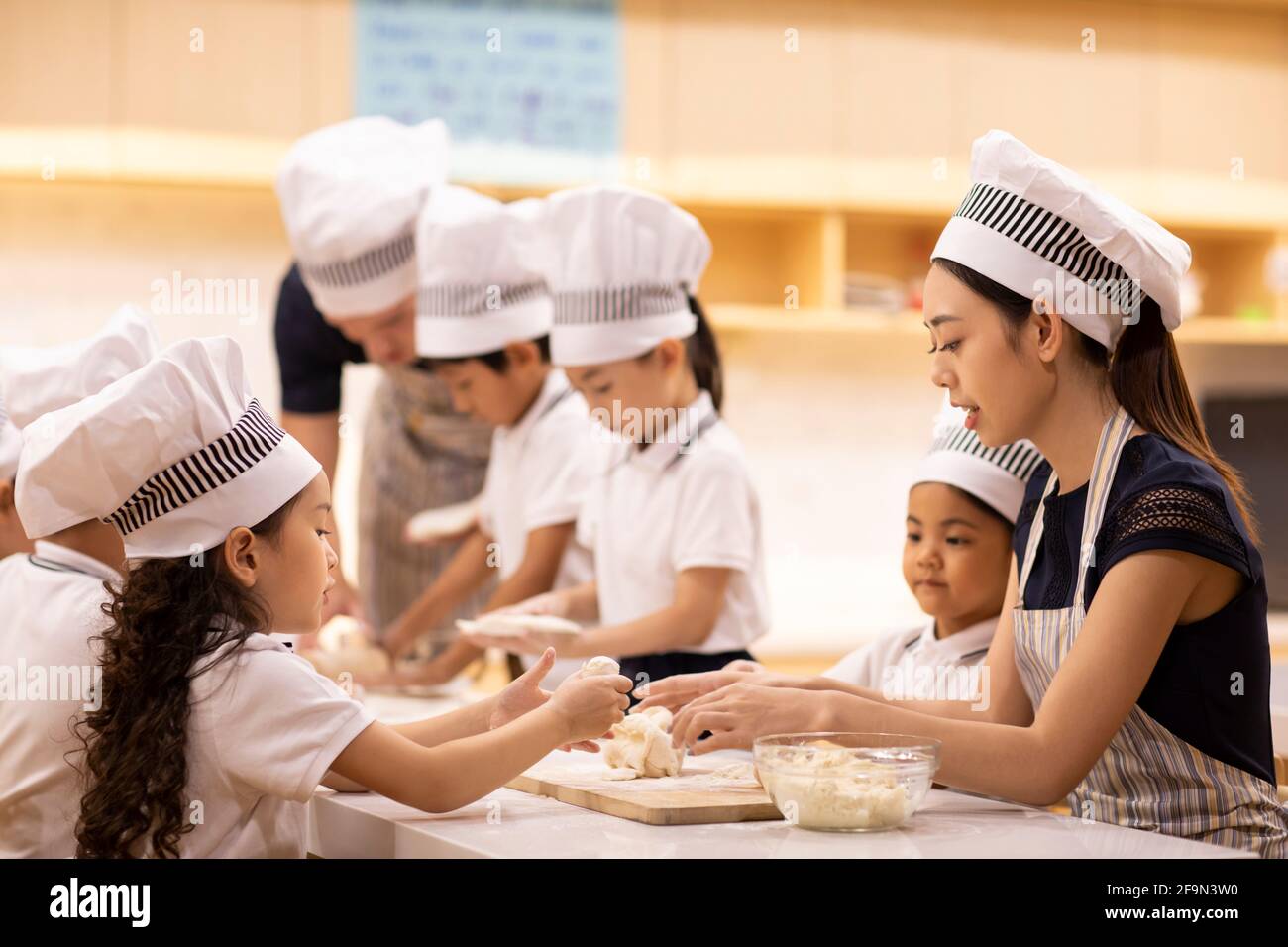 Children learning cooking in classroom Stock Photo Alamy