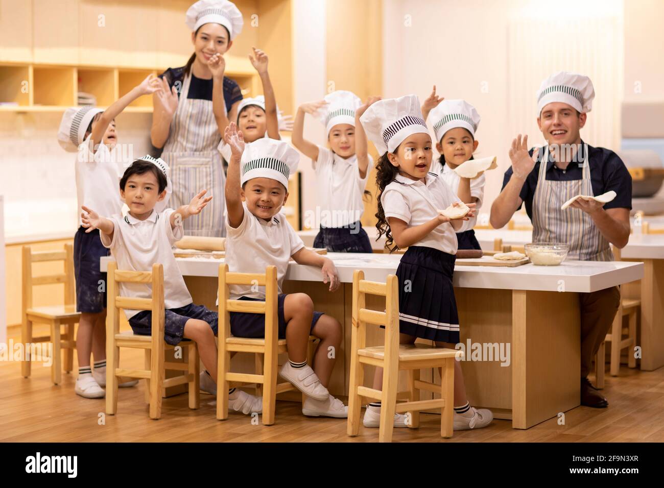 Children learning cooking in classroom Stock Photo Alamy