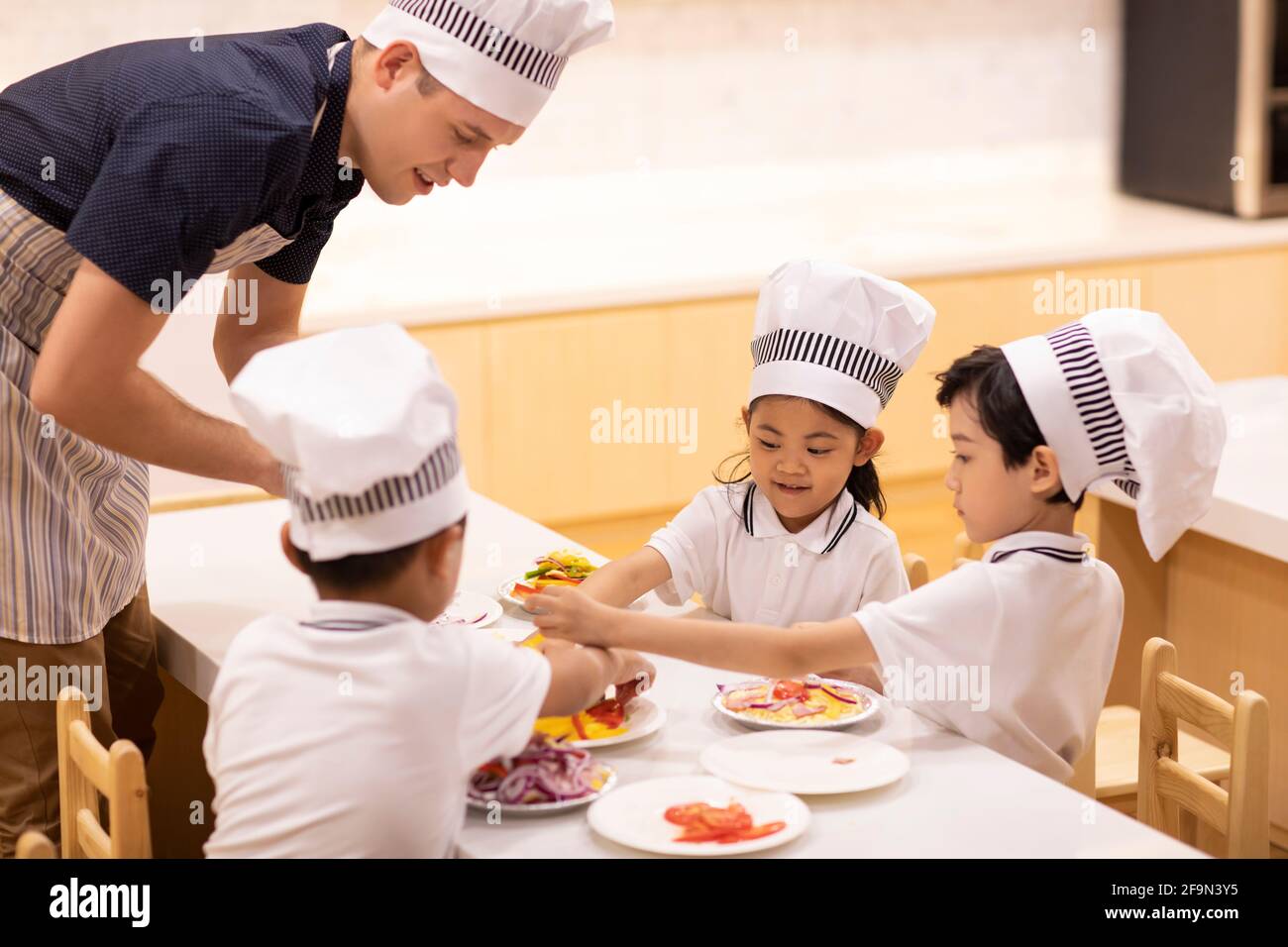 Children learning cooking in classroom Stock Photo Alamy