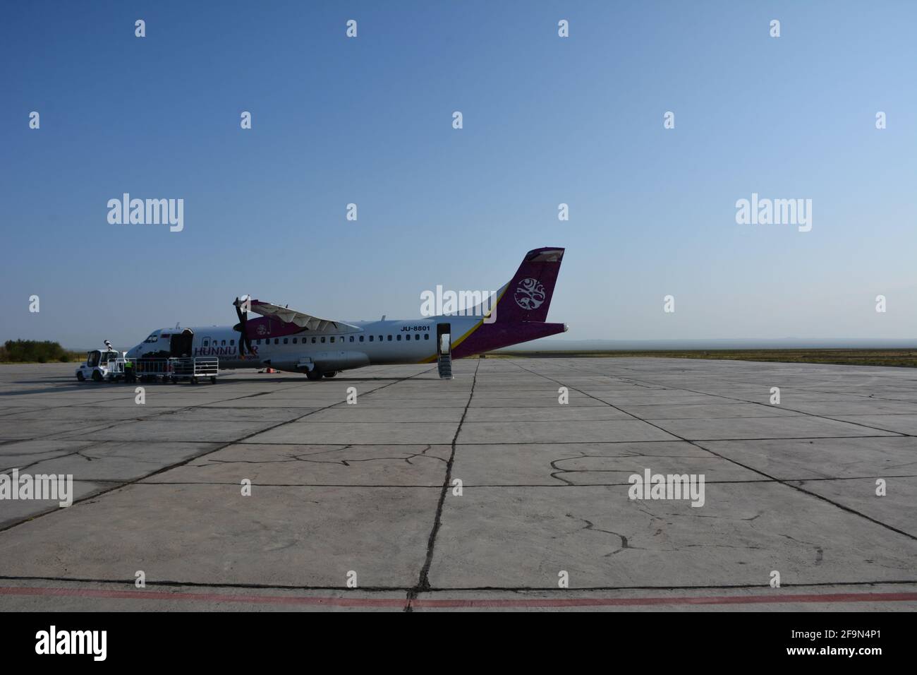 A Hunnu Air flight after landing in the early morning at Dalanzadgad, Ömnögovi Province, Mongolia. The airport is the gateway to the Gobi Desert. Stock Photo