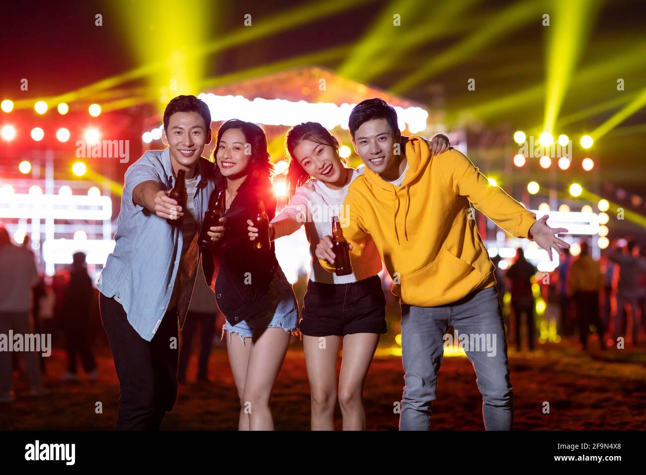 Happy young friends at music festival Stock Photo - Alamy