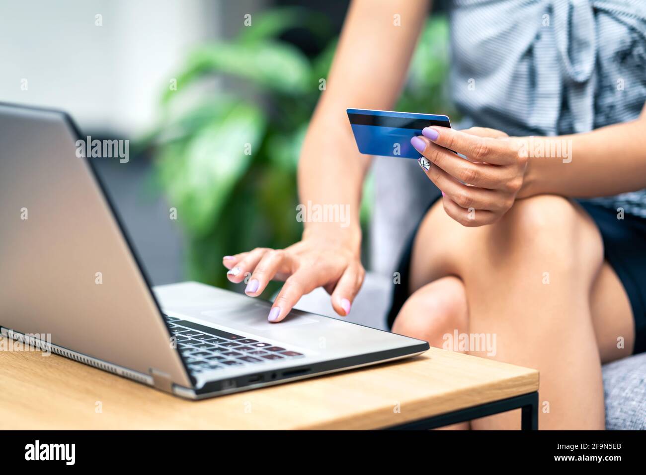 Credit card purchase and payment with laptop. Woman shopping online and buying from internet store sale. Ecommerce or transaction security from scam. Stock Photo