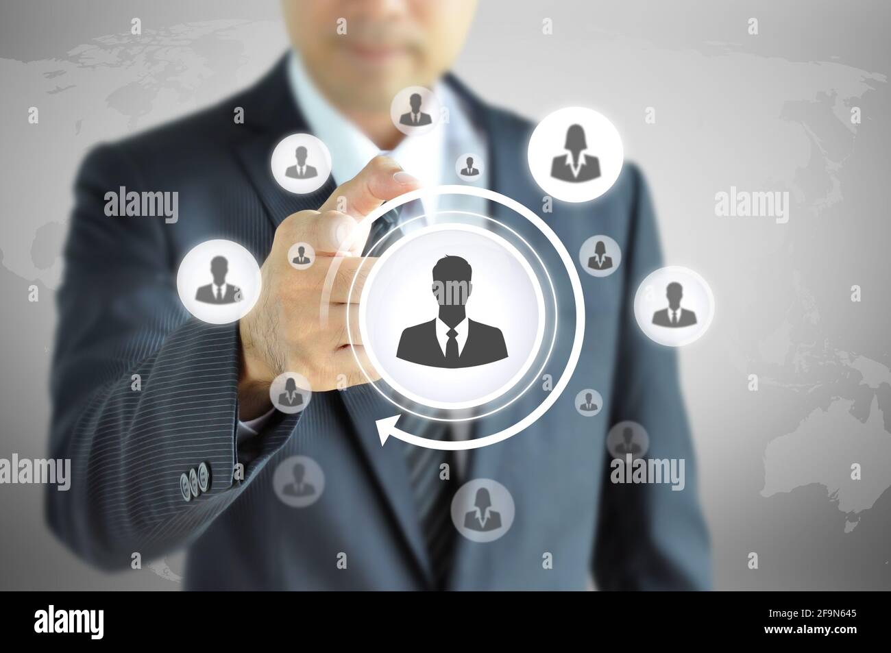 Hand pointing to businessman icon  - HR, recruitment and chosen concept Stock Photo