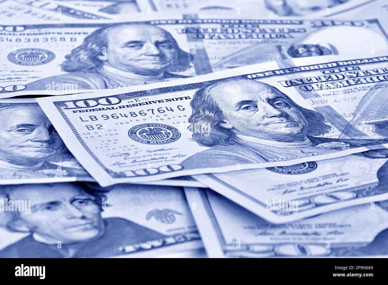 Money - United States dollars (USD) bills in retro blue color effect Stock Photo