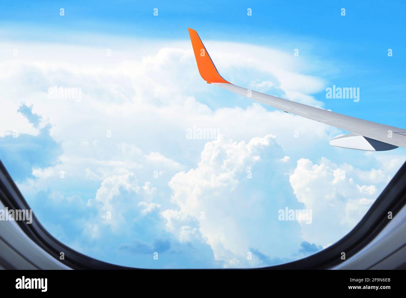 Aerial view of clouds & sky from window of the airplane Stock Photo - Alamy